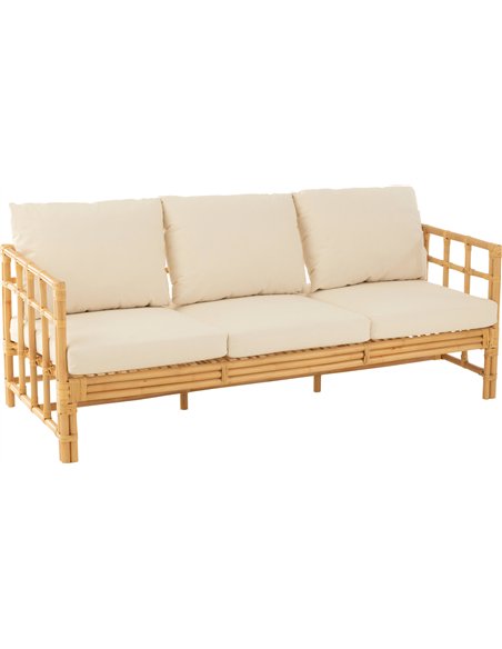 canapé rotin naturel trois places avec coussins blancs confortables