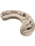 Canapé d'angle courbe en tissu beige vu de dessus avec coussins