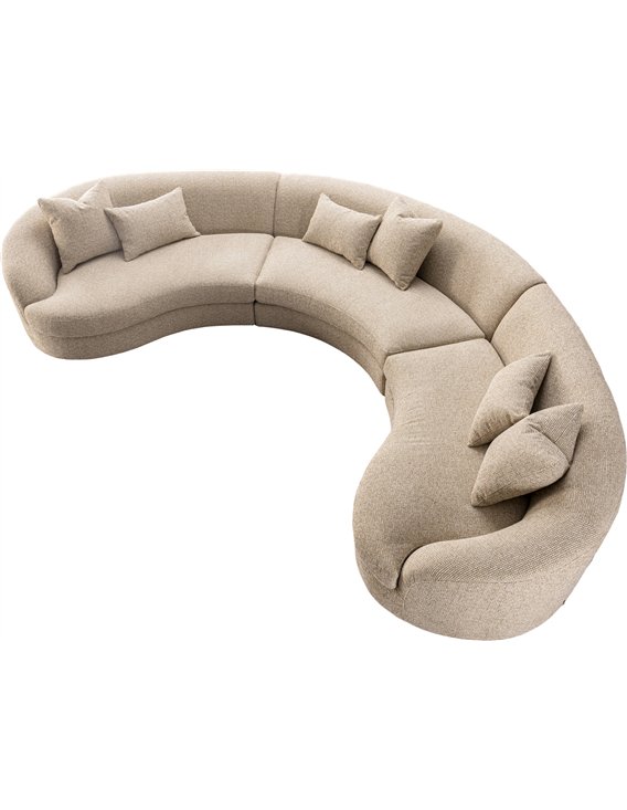 Canapé d'angle courbe en tissu beige vu de dessus avec coussins