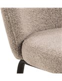 Gros plan sur le tissu bouclé beige et sa couture verticale du dossier