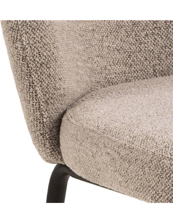 Gros plan sur le tissu bouclé beige et sa couture verticale du dossier