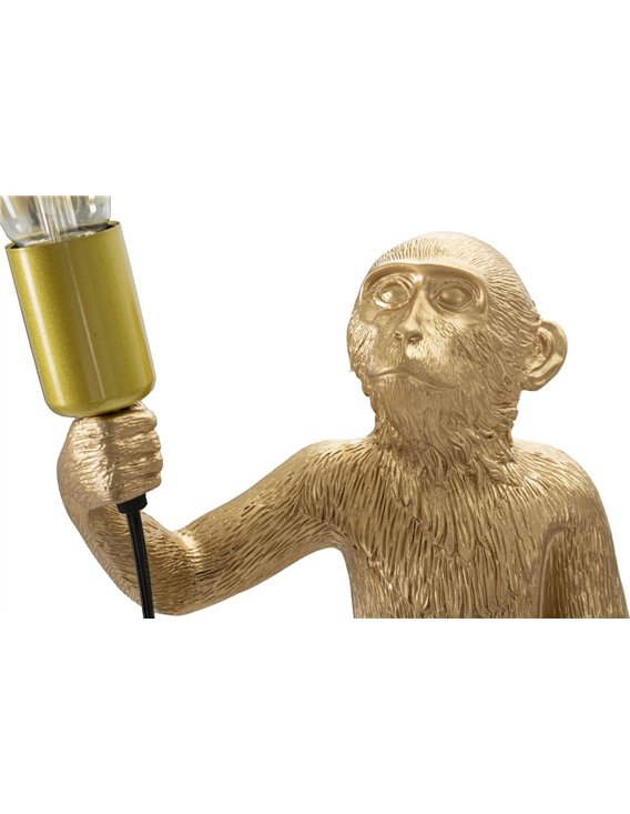 Détail sculpté de lampe singe