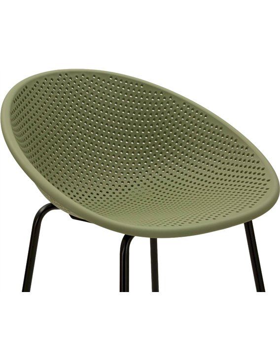 Vue rapprochée de l'assise ajourée d'un tabouret de bar vert kaki