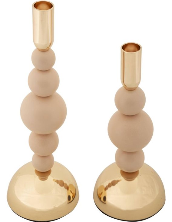 Vue de détail des sphères superposées beige rosé et du pied doré