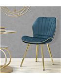 Chaise bleu canard capitonnée dans un décor gris avec table dorée