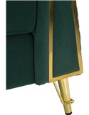 Gros plan sur le pied doré et la finition latérale du fauteuil vert