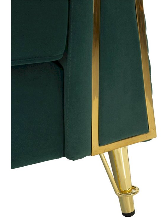 Gros plan sur le pied doré et la finition latérale du fauteuil vert