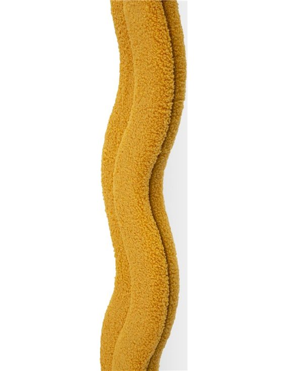 Gros plan sur le bouclé jaune moutarde du cadre et la courbe du bord