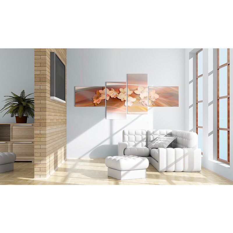 Tableau orchidée blanche sur fond d'automne accroché dans un salon blanc avec canapé et pouf