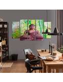 Tableau le bouddha sur fond de bambou accroché au mur gris d'une salle à manger