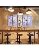 Tableau trois fleurs au-dessus d'un bar, entouré de suspensions noires et de tabourets