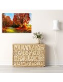 Tableau paysage d'automne suspendu au-dessus d'un meuble bas décoratif