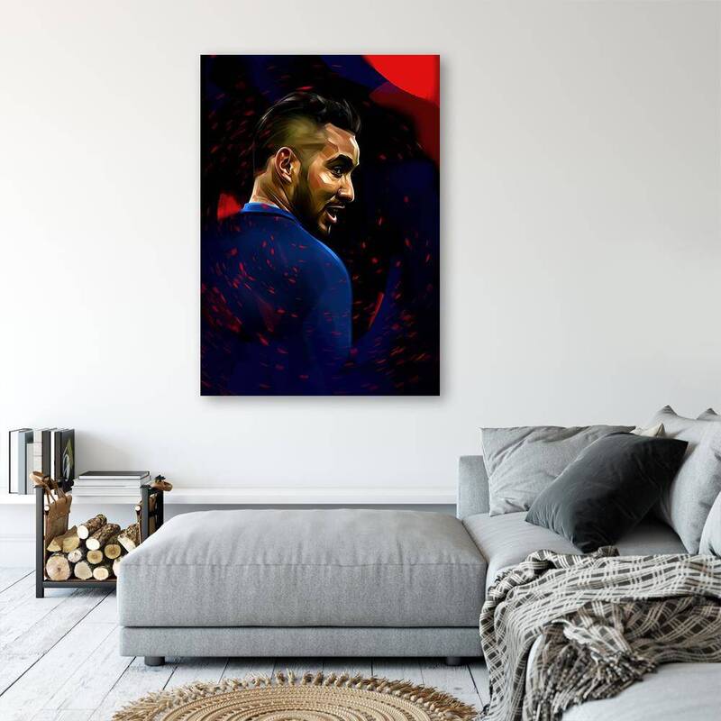 Tableau portrait de footballeur de profil au-dessus d'un canapé gris et d'un pouf