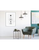 Tableau cadre Intuition accroché dans un salon, avec fauteuil vert et lampes suspendues autour